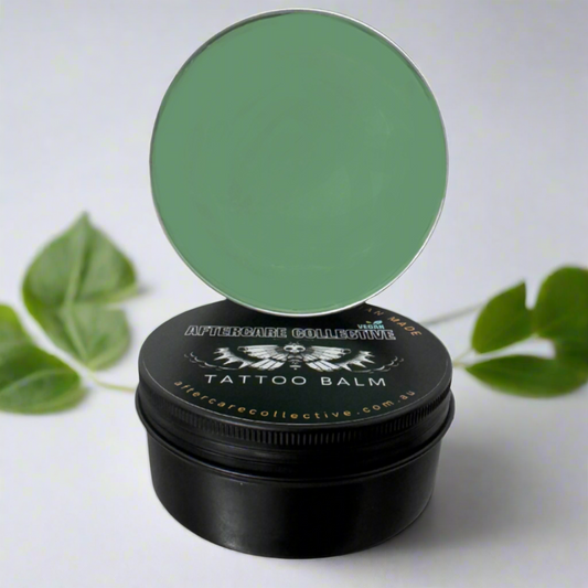 Close-up of Soothie Bowl Tatt Elixir Balm – the best tattoo aftercare solution, featuring a premium vegan formula inspired by a smoothie bowl and designed for optimal tattoo healing, available wholesale.”